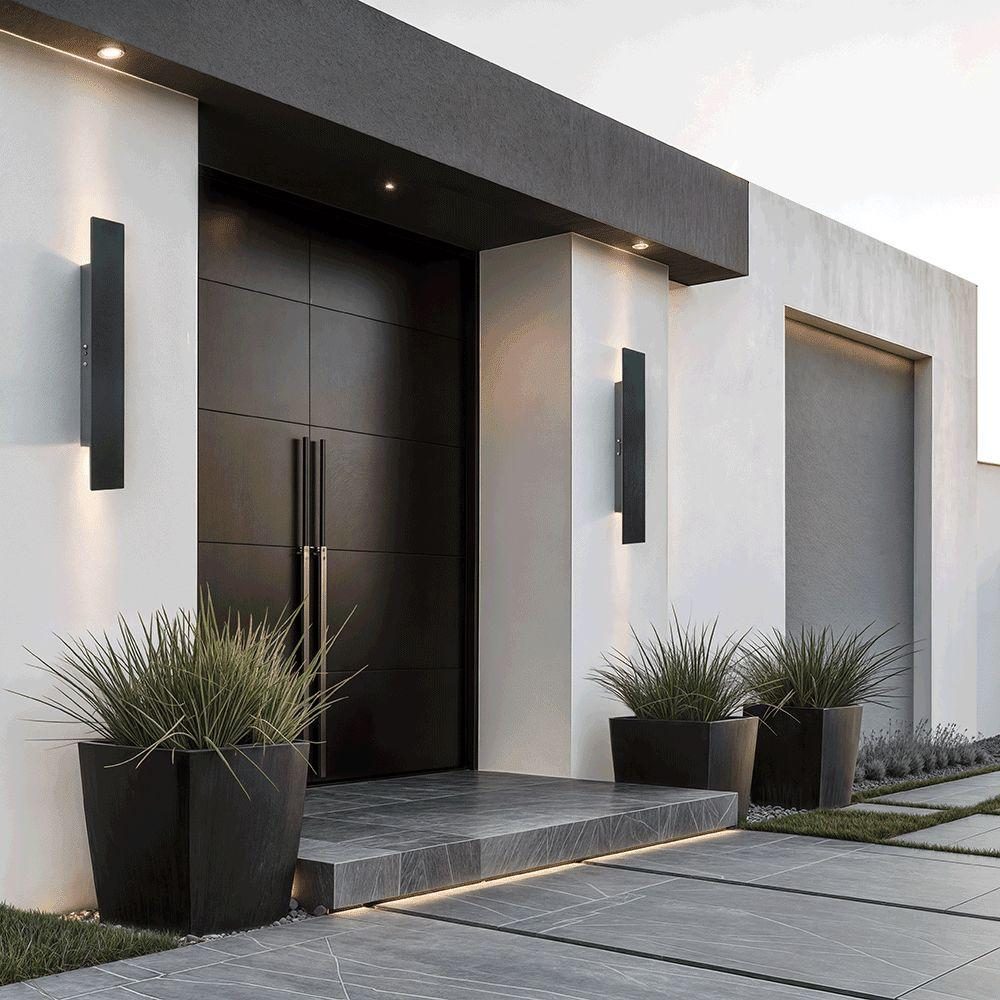 Dark entrance door beneath a cantilevered canopy