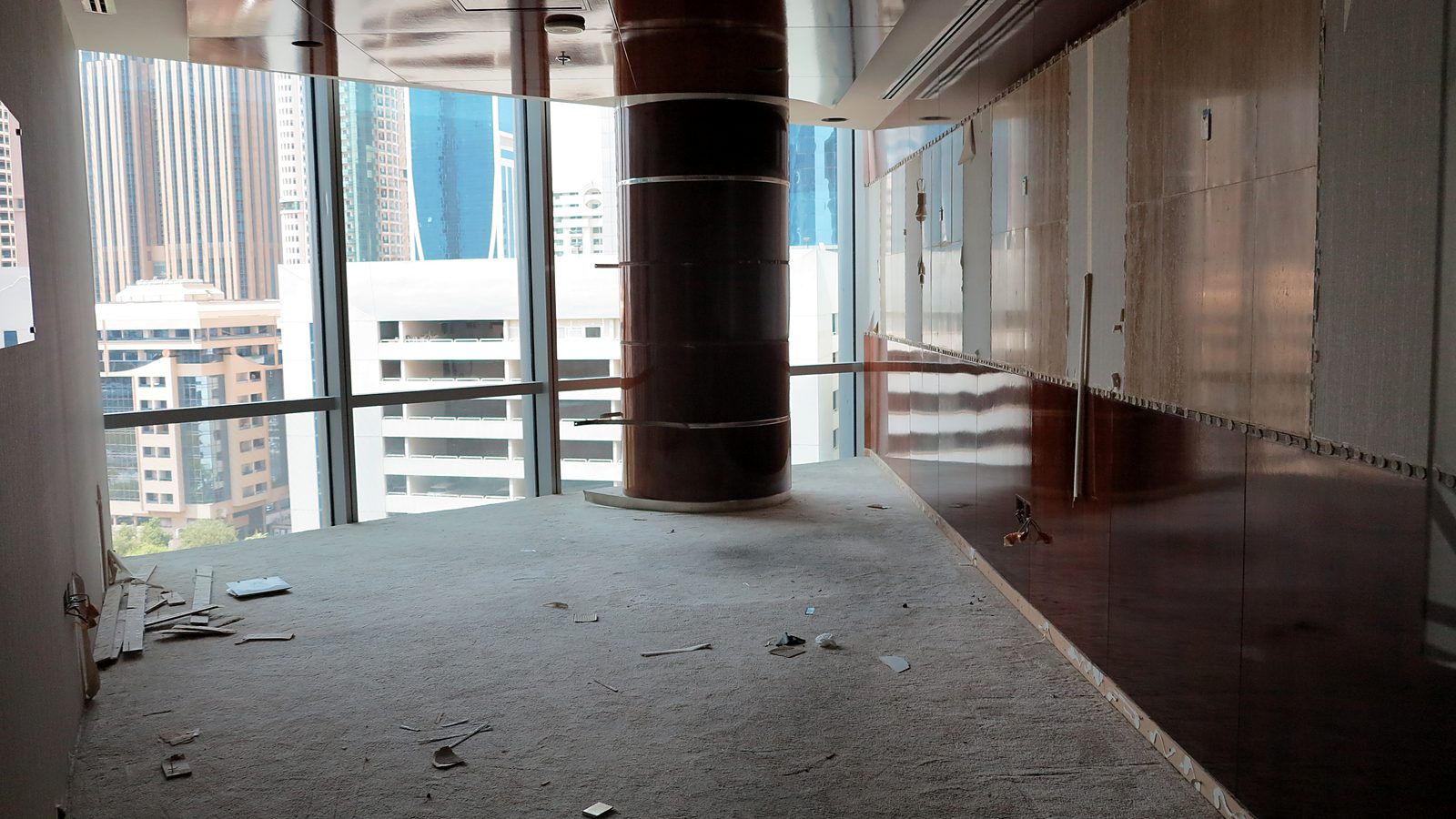 Perimeter glazing with old wall panels being removed