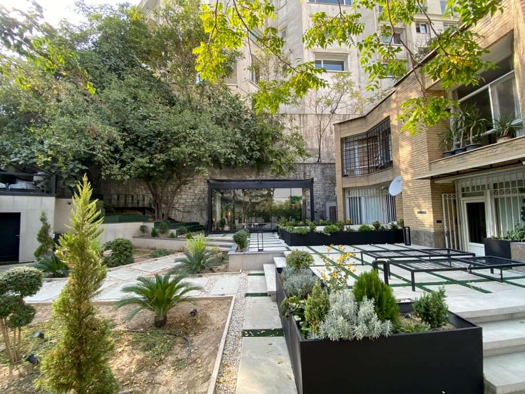 Landscaped courtyard with planters and stone paving