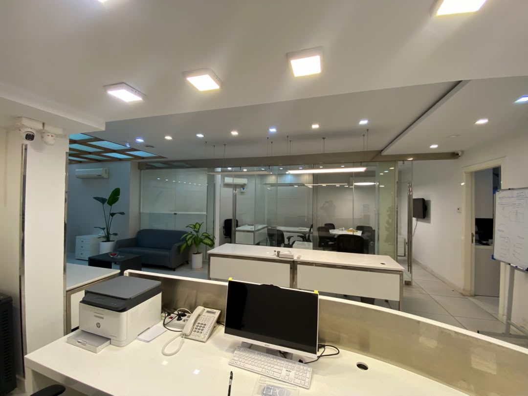 Front desk looking through to glass-partitioned offices