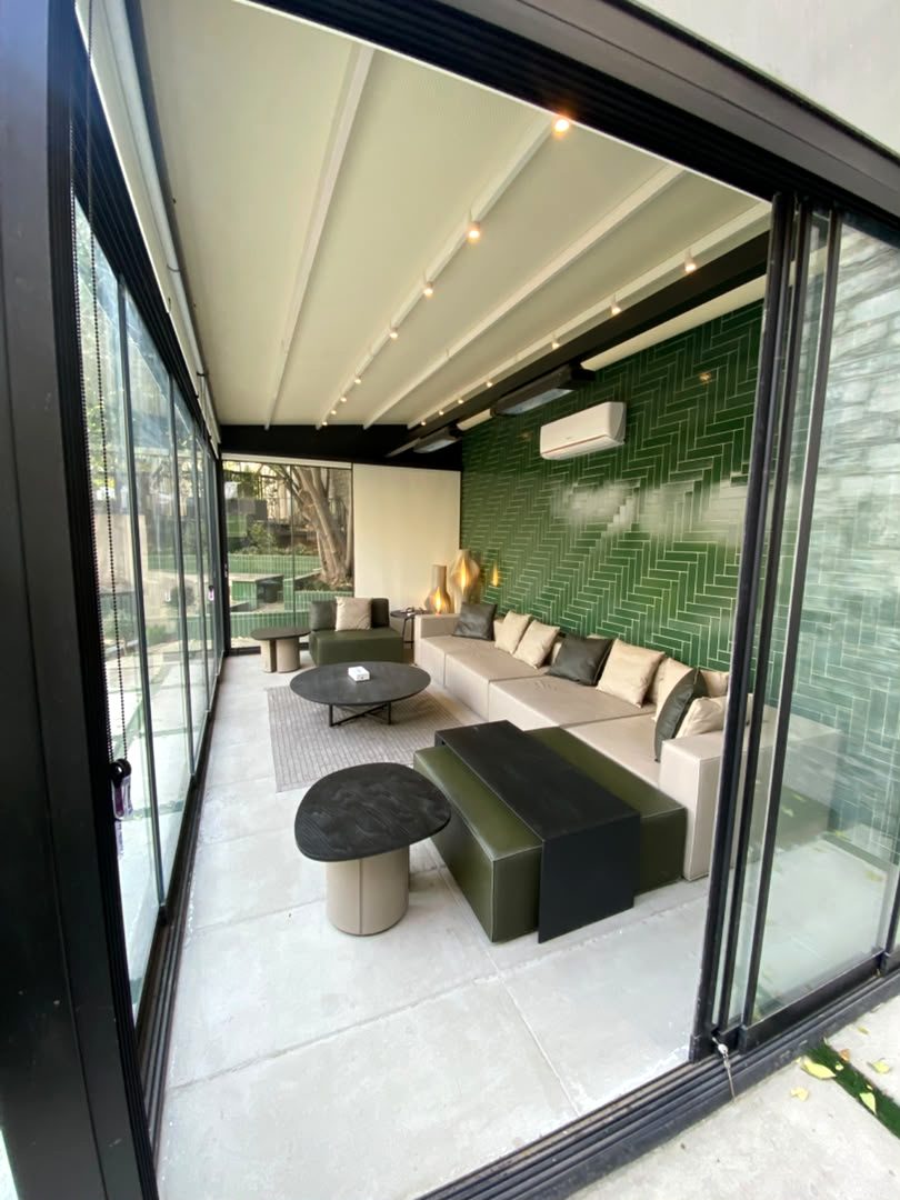 Glazed lounge with green herringbone tiling, from an EPCI office renovation