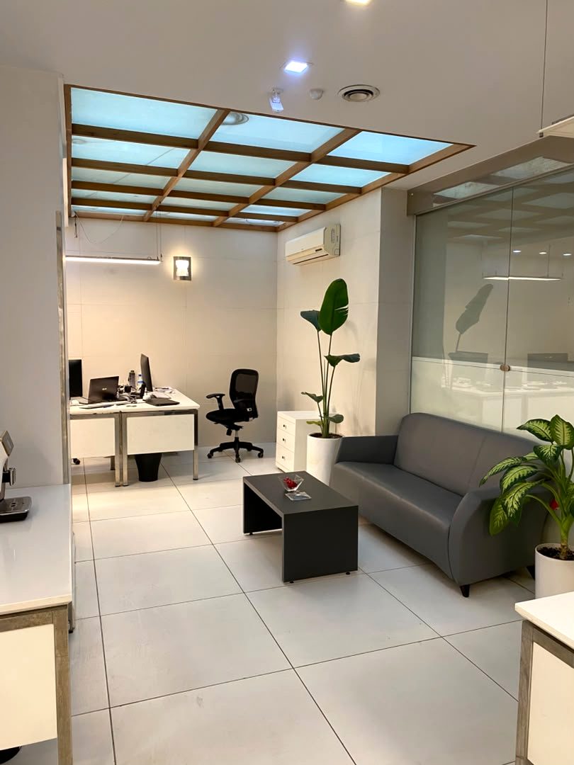 Private office under a backlit timber-framed ceiling