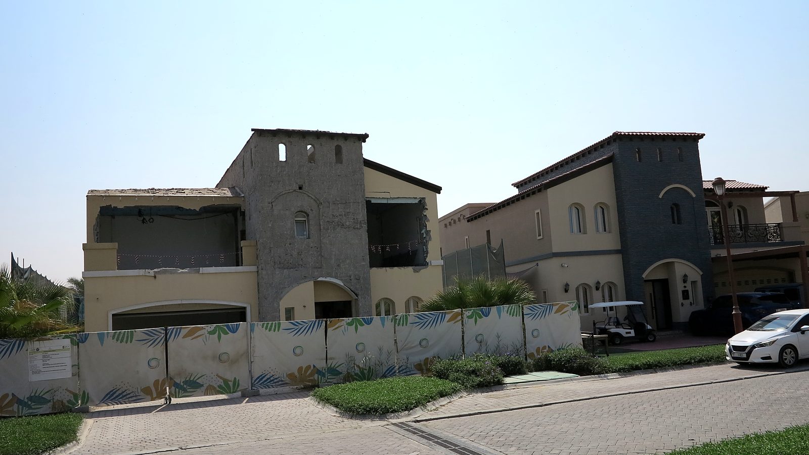 The original villa from the street, behind site hoarding